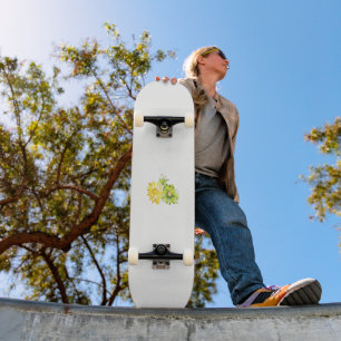 two yellow and green flowers on a white background skateboard