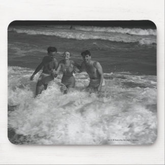 Two young men and woman playing in wave B&W Mouse Mat