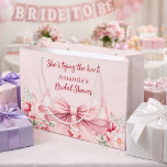 Tying the knot pink bow floral Bridal Shower Large Gift Bag<br><div class="desc">Blush pink background decorated with a pink coloured bow and pink roses,  flowers. Personalise and add a name
Text: She's tying the knot</div>