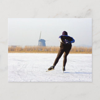 Typically dutch: ice skating on a frozen lake postcard