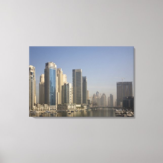 UAE, Dubai. Marina towers with boats at anchor. Canvas Print (Front)