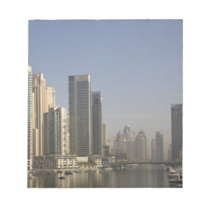 UAE, Dubai. Marina towers with boats at anchor. Notepad