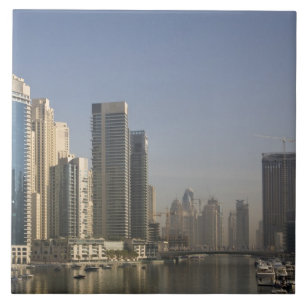 UAE, Dubai. Marina towers with boats at anchor. Tile