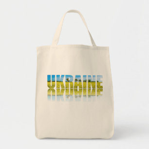 Ukraine label with blue sky and yellow field tote bag