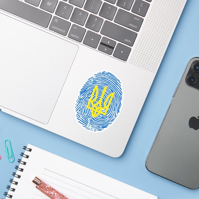 Ukrainian coat of arms on fingerprint background (Laptop w/ iPhone)