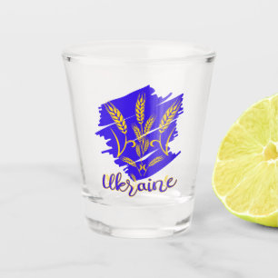 Ukrainian national symbol tryzub made of wheat ear shot glass