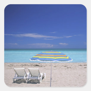 Umbrella and two lounge chairs on beach, Miami Square Sticker