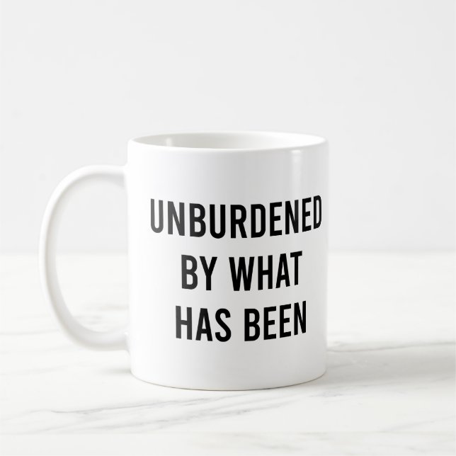 Unburdened By What Has Been Funny Political Coffee Mug (Left)