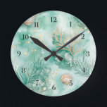 Underwater Coral & Shells in Teal Watercolor Round Clock<br><div class="desc">Transform your space into a serene seaside escape with this stunning round clock featuring an underwater coral and shell design. Painted in calming teal tones with watercolor textures, the design captures the quiet magic of the ocean floor. Soft coral branches and delicate seashells seem to float across the clock face,...</div>