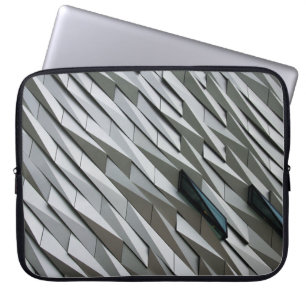 Undulating abstract shapes on a building facade at laptop sleeve