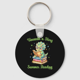 Unearth a story triceratops dinosaur reading books key ring