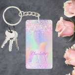 Unicorn pink purple name holographic key ring<br><div class="desc">A trendy holographic background with unicorn and pastel colours in pink,  purple,  mint green. Decorated with faux glitter. Personalise and add your name.  Purple coloured letters.  A bit of everyday glam to brighten up your day!</div>