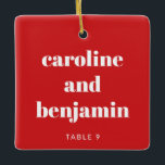 Unique Custom Place Card Christmas Wedding Red Ceramic Ornament<br><div class="desc">Make your winter wedding extra special with this unique custom ceramic ornament in red and white, doubling as a personalised place card for your guests. Featuring their name in elegant typography, it serves as a thoughtful escort card and a keepsake they can treasure. Perfect for a Christmas wedding, this festive...</div>