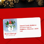 Unique Fun Snowman Christmas Tree Return Address Label<br><div class="desc">Add a festive touch to your holiday mail with this horizontal address label featuring the party-ready snowman. His red Santa hat, green scarf, and red buttons pop against the wintry backdrop of pine trees and snowflakes. The editable text includes your name and address alongside the cheerful snowman illustration. Ideal for...</div>