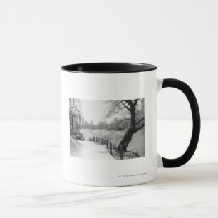 Urban park with tranquil lake mug