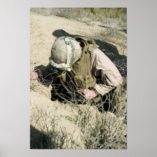 US Marine jumps down a hole Poster
