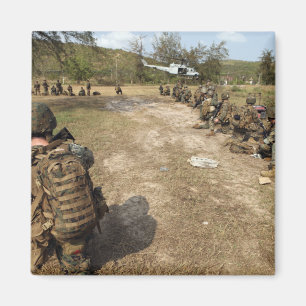 US Marines provide security as a UH-1N Magnet