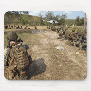 US Marines provide security as a UH-1N Mouse Mat