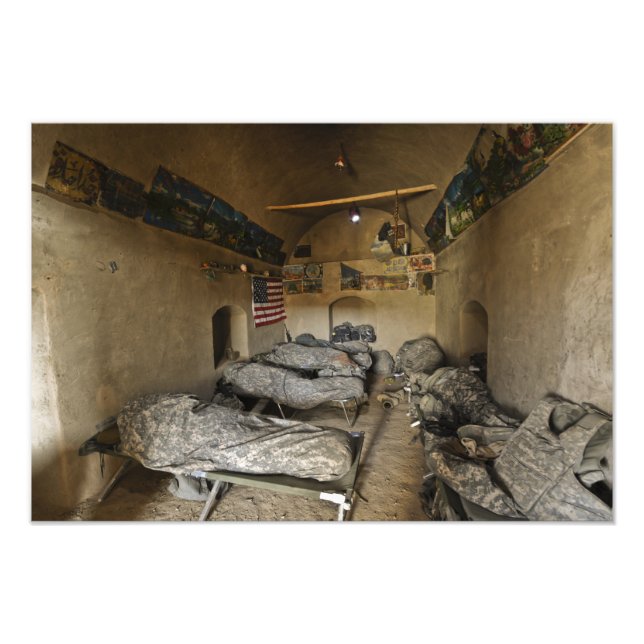 US Soldiers sleep in an abandoned mud house Photo Print (Front)
