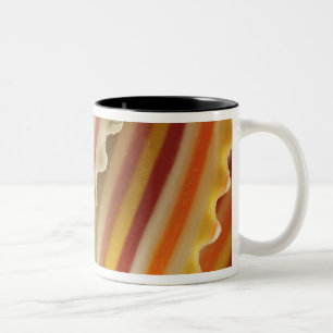 USA. Close-up of dried rainbow pasta noodles. Two-Tone Coffee Mug
