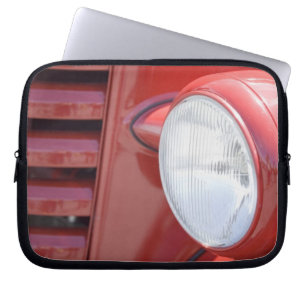 USA, Maine, Owl's Head. Headlight and partial Laptop Sleeve