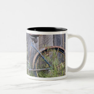 USA, Oregon, Bend. A dilapidated old bike Two-Tone Coffee Mug