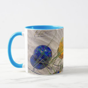 USA, Oregon. Colourful Glass Floats On Sand Dune Mug