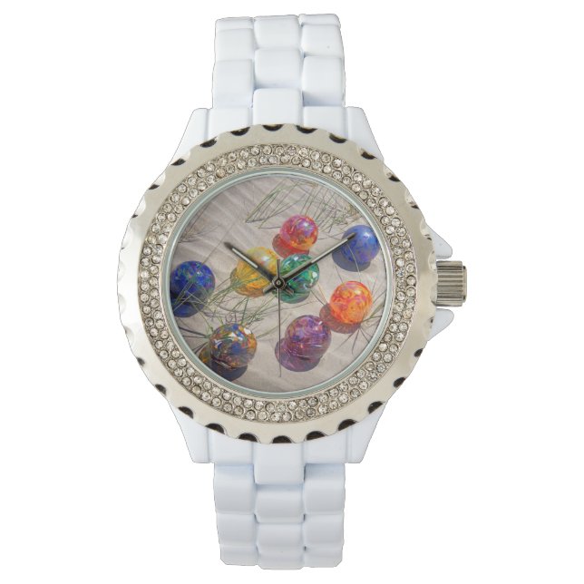 USA, Oregon. Colourful Glass Floats On Sand Dune Watch (Front)