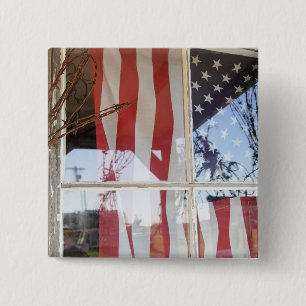 USA, Oregon, Shaniko. Flag in window next to 15 Cm Square Badge