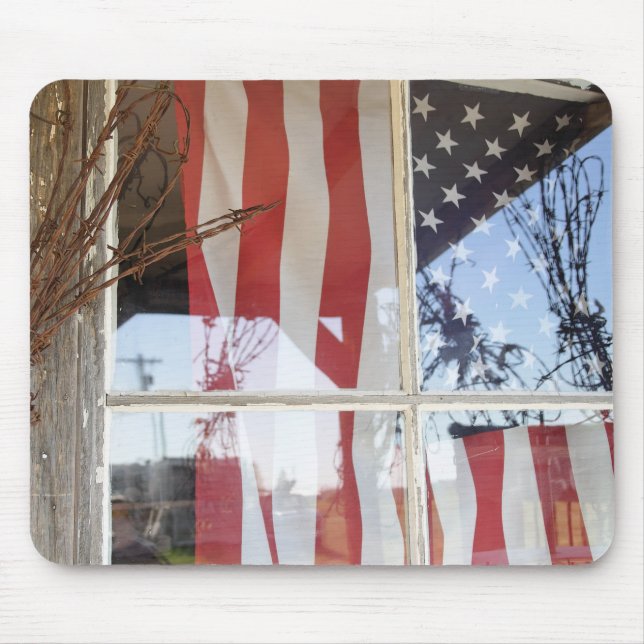 USA, Oregon, Shaniko. Flag in window next to Mouse Mat (Front)