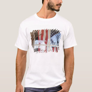 USA, Oregon, Shaniko. Flag in window next to T-Shirt