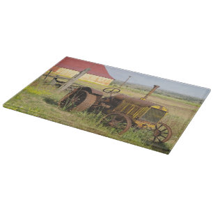 USA, Oregon, Shaniko. Rusty vintage tractor in Cutting Board