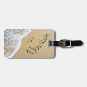 Vacations carved sign on the beach sand luggage tag