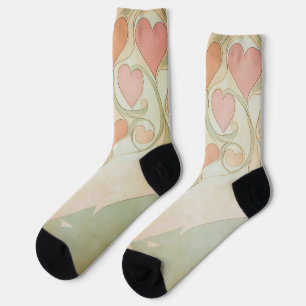 Valentine hearts background in pale pink and green socks