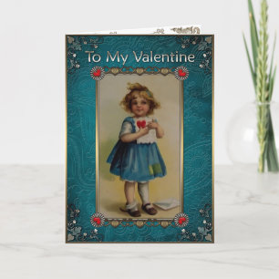 Valentine's Day. Little girl in blue with a letter Holiday Card