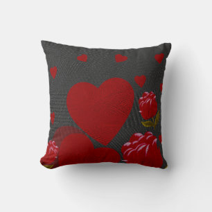 Valentine's day, red heart, red rose on grey cushion