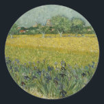 Van Gogh Field With Flowers Near Arles Classic Round Sticker<br><div class="desc">Incorporated in the design on this product is an appealing print of "Field With Flowers Near Arles" an oil on canvas painting created in 1888 by Vincent van Gogh. Vincent van Gogh (1853 – 1890) was a Dutch Post-Impressionist painter who in just over a decade created approximately 2, 100 paintings...</div>
