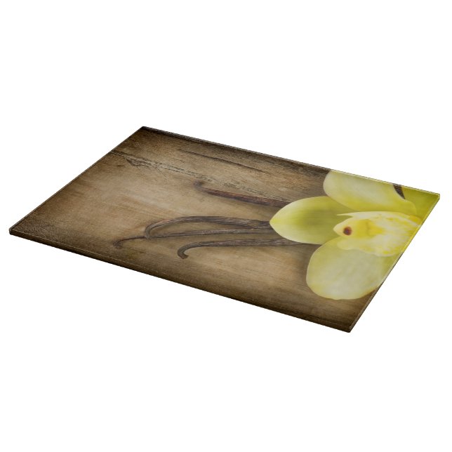 Vanilla Pods and Flower over Wooden Background Cutting Board (Corner)