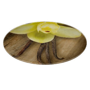 Vanilla Pods and Flower over Wooden Background Cutting Board