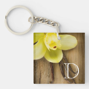 Vanilla Pods and Flower over Wooden Background Key Ring