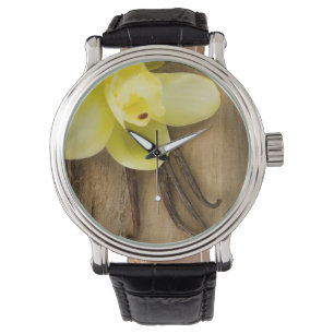 Vanilla Pods and Flower over Wooden Background Watch