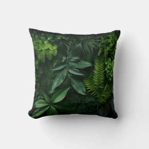 Various plant leaves on a dark background cushion