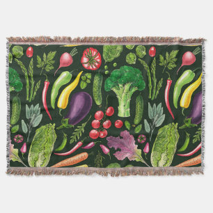 Vegetable and herbs garden harvest on black throw blanket