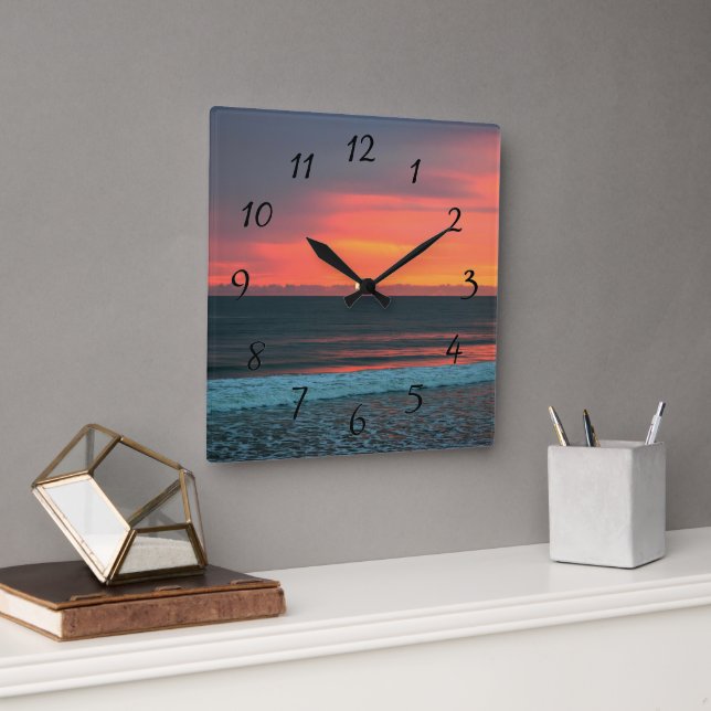 Vibrant colour sunrise over the ocean square wall clock (Office)