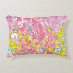 Vibrant fabric pattern featuring pink, yellow, and decorative cushion