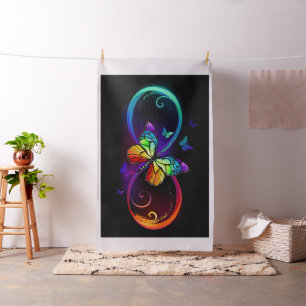 Vibrant infinity with rainbow butterfly on black fabric