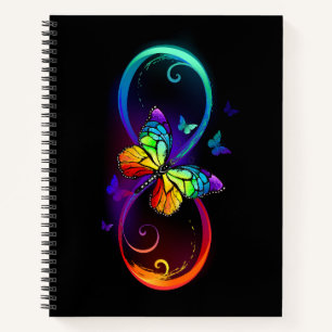 Vibrant infinity with rainbow butterfly on black notebook