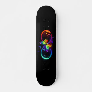 Vibrant infinity with rainbow butterfly on black skateboard