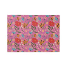 Vibrant pink rug with red, blue and orange flowers