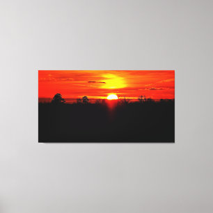 Vibrant Sunset Over Forest Horizon Canvas Print